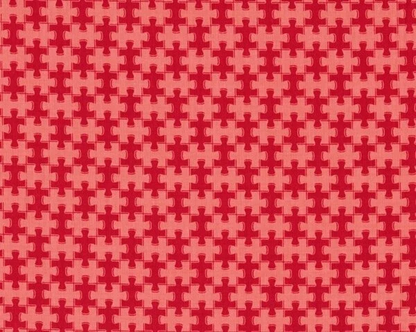 Patchworkstoff "Pieces of Hope" mit Puzzle-Teilen, rot-helles lachsrot